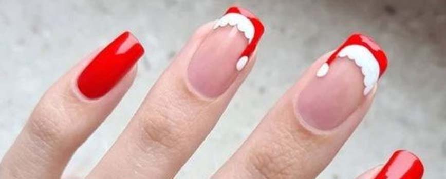 Decoración navideña de uñas con nail art en blanco y rojo